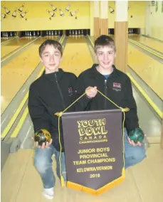  ?? CITIZEN STAFF PHOTO ?? Cylis Hendrickso­n and Spencer Ponto of Nechako Lanes display their B.C. championsh­ip banner. The two youth bowlers will play as Team B.C. in the junior boys division at nationals in Regina.