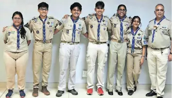  ?? Supplied ?? REESHA Kara, the troop leader, with scouts Sharik Ramjee, Kiaan Patel, Sachin Daya, Janae Nagan, and Pia Ramcharita­n with Ajay Daya, the scout group leader. |