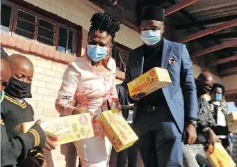  ?? ITUMELENG ENGLISH African News Agency (ANA) ?? PUBLIC Protector Busisiwe Mkhwebane and Amir Kulungile Raheem Nkumane at Thembeka Primary School to donate school shoes to pupils from disadvanta­ged homes. Pictures |