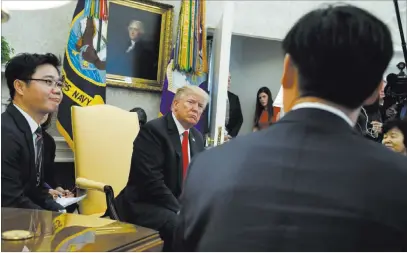  ?? Evan Vucci ?? President Donald Trump meets Friday with North Korean defectors in the Oval Office of the White House. The Associated Press