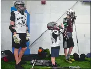  ?? SARAH GORDON THE DAY ?? Reagan Pierce grabs some water during a break in lacrosse practice at Wide World of Indoor Sports in Montville.