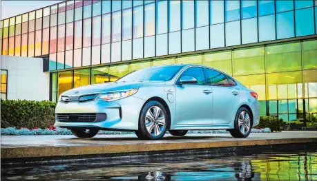  ??  ?? Kia’s new Optima PHEV is a plug-in vehicle that can run purely on electric power for up to 27 miles. After that, a gasoline engine extends its range for a total of more than 600 miles.