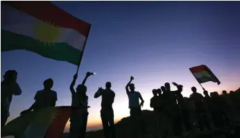  ??  ?? Iraqi Kurds in the town of Akra demonstrat­e their support for the independen­ce vote