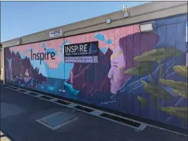  ?? JAKE HUTCHISON — ENTERPRISE-RECORD ?? A mural provides a burst of color on the exterior of a classroom building at Inspire School of Arts and Sciences on Oct. 3, 2023in Chico.