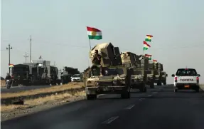  ?? Reuters ?? Vehicles of Kurdish Peshmarga forces near Altun Kupri between Kirkuk and Erbil, on Friday