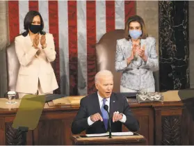  ?? Doug Mills / New York Times ?? President Biden addresses a joint session of Congress last week, flanked by Vice President Kamala Harris (left) and House Speaker Nancy Pelosi.