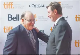  ?? CP PHOTO ?? Hockey greats Scotty Bowman and Wayne Gretzky arrive at the premiere of “Red Army” during the 2014 Toronto Internatio­nal Film Festival. Bowman wonders now how feasible it is in today’s NHL to win back-to-back Stanley Cups.