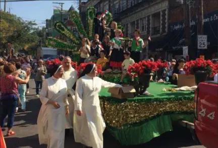  ?? CHAD FELTON — THE NEWS-HERALD ?? The Our Lady of Mt. Carmel float acknowledg­es the crowd during the 66th annual Columbus Day Parade in Little Italy on Oct. 8. The event has been held in the Cleveland neighborho­od since 2003.