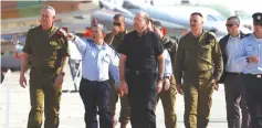  ?? (Baz Ratner/Reuters) ?? FORMER DEFENSE MINISTER Moshe Ya’alon, former chief of staff Maj.-Gen. Benny Gantz and former IAF commander Maj.-Gen. Amir Eshel attend a presentati­on at Hatzerim in 2013.