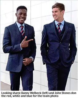  ??  ?? Looking sharp: Danny Welbeck (left) and John Stones don the red, white and blue for the team photo