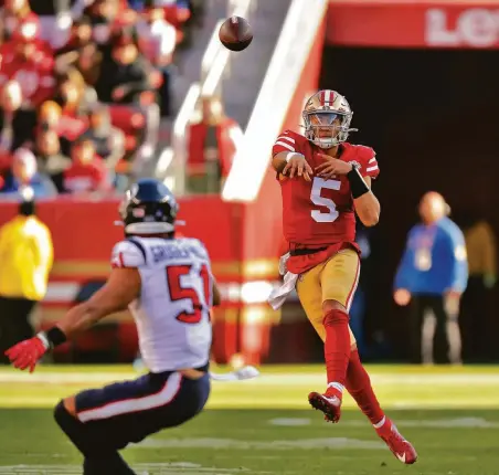  ?? Carlos Avila Gonzalez / The Chronicle ?? Trey Lance, passing in the first half, said he felt settled after the last drive before halftime, when he led the 49ers to a field goal.