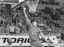  ?? Sue Ogrocki / Associated Press ?? Texas Tech’s Jarrett Culver scores with the greatest of ease, symbolic of how it went against Oklahoma State on Wednesday.