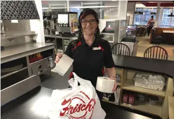  ?? AP ?? VALUE ADDED: At a Frisch’s Big Boy restaurant in Cincinnati, groceries have been added to the menu, including toilet paper.