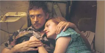  ?? IFC Films ?? BOYD HOLBROOK, shown with Elisabeth Moss, is an ex-con trying to rebuild his life in “The Free World.”