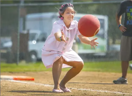  ?? File Photo ?? Rylee “Fran” Wormington of Rogers fields a ball during her team’s 2014 game during the annual Kick the Competitio­n Kickball Tournament. The 2015 tournament to benefit the Northwest Arkansas Children’s Shelter will be played Oct. 2 at Memorial Park in...