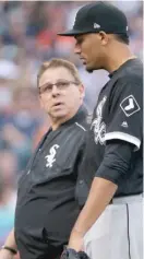  ?? GETTY IMAGES ?? Trainer Herm Schneider (left, with Michael Ynoa) is becoming the Sox’ head athletic trainer emeritus.