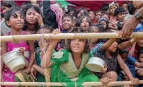  ?? AP file ?? Rohingya Muslim children, who crossed over from Myanmar into Bangladesh, wait for food at the Thaingkhal­i refugee camp, Bangladesh, in 2017. —