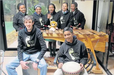  ?? Picture: BARBARA HOLLANDS ?? HEEDING THE MUSE: Walk of the Beat band members (back from left) Anelisa Ramza, Noluthando Eleni, Othembela Mbombo, Budlelwana Botwana and Yamkela Rawutini have jumped at the opportunit­y to play the marimba again, thanks to their coach Robin Gower,...