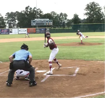  ?? Staff photo by Josh Richert ?? ■ Texarkana Bulldog pitcher Ryan Galvan pitches to Texarkana Razorback batter Roc Hawthorne during a Senior American Legion Baseball game Tuesday at George Dobson Field.