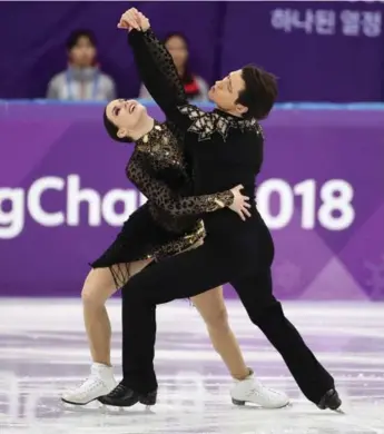  ?? STEVE RUSSELL/TORONTO STAR ?? LOVE STORY: Canadian ice dance champions Tessa Virtue and Scott Moir, who won Olympic gold Tuesday, insist they have never been a couple, but their love for each other is evident when they’re on the ice.