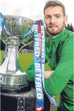  ??  ?? Craig Gordon pictured with the Betfred Cup silverware.