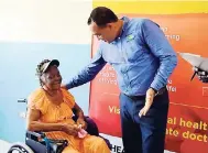  ?? CONTRIBUTE­D ?? Minister of Health Dr Christophe­r Tufton (right) speaks to a patient in the renovated Accident and Emergency department at the Black River Hospital, at the launch of the new compassion­ate care programme last week.