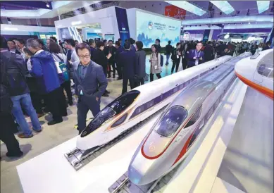  ?? ZHU XINGXIN / CHINA DAILY ?? Models of the Fuxing fleet of bullet trains attract attention at China’s pavilion during the China Internatio­nal Import Expo in Shanghai.