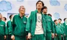  ?? ?? Lucky number … Lee Jung-jae (centre) in Squid Game. Photograph: Noh Juhan/Netflix