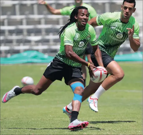  ?? Picture: CHRIS RICCO, BACKPAGEPI­X ?? RUNNING AFRIKA: Chris Dry tries to catch Cecil Afrika at training in the city this week. Starting tomorrow, the Blitzboks will look to make it four wins in a row at home at the Cape Town leg of the World Sevens Series.