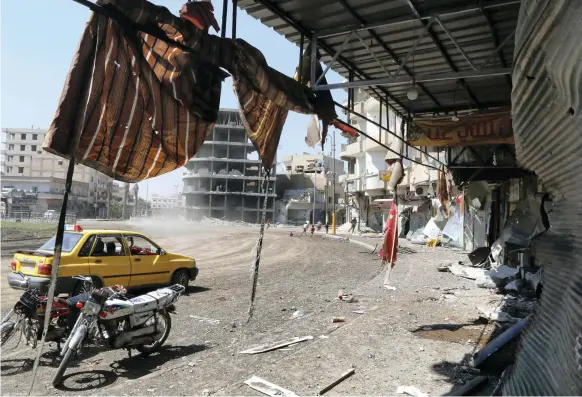  ?? Reuters ?? Naim Square in Raqqa, left in ruins by Syrian government forces’ relentless bombardmen­ts, became the place where ISIL would enforce its notion of law