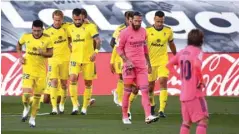  ?? (AFP) ?? Cadiz’s forward Anthony Lozano (third left) celebrates with teammates after scoring against Real Madrid in La Liga in Valdebebas, northeaste­rn Madrid, yesterday.