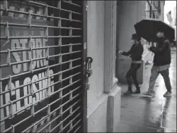  ?? TRIBUNE NEWS SERVICE ?? A store stands closed near Wall Street as the coronaviru­s keeps financial markets and businesses mostly closed on May 8, 2020, in New York City