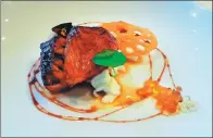  ?? PHOTOS PROVIDED TO CHINA DAILY ?? The grilled perch served on sauteed egg white with balsamic pearls is another modern creation of chef Ma Haocheng infused with the flavors of Shanghai.