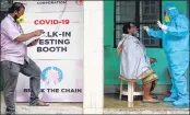  ?? —AFP ?? A health worker takes a swab sample from a man to test for the Covid-19 at a testing centre in Chennai on Friday.