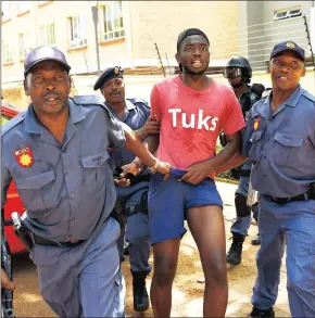  ?? Picture: MASI LOSI ?? COME WITH US: Police officers arrest a University of Pretoria student last year during the #FeesMustFa­ll protests.