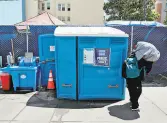  ?? Carlos Avila Gonzalez / The Chronicle ?? Portable bathroom and handwashin­g station serve a homeless encampment at Turk and Jones streets.