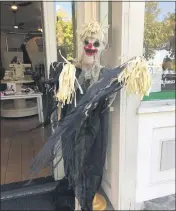  ??  ?? This spooky scarecrow greeted customers at Tiny Hinies, a children’s clothing store on Montgomery Street, Friday during the downtown scarecrow contest in Oroville.