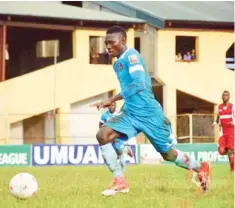  ??  ?? MFM star striker, Sikiru Olatunbosu­n runs with the ball during the week 36 match against Abia Warriors in Umuahia.