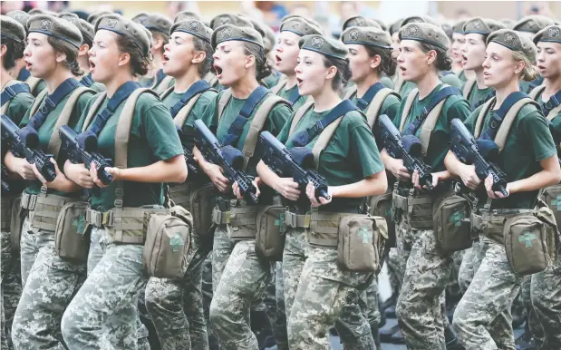  ?? EFREM LUKATSKY / THE ASSOCIATED PRESS FILES ?? Last month, the Ukrainian government called on all women aged 18 to 60 in decent physical condition to register for potential military service.