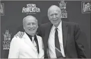  ??  ?? In this 2014 file photo, Mel Brooks (left) stands with Carl Reiner during Brooks’ hand and footprint ceremony on the 40th anniversar­y of the movie “Young Frankenste­in,” in Los Angeles.