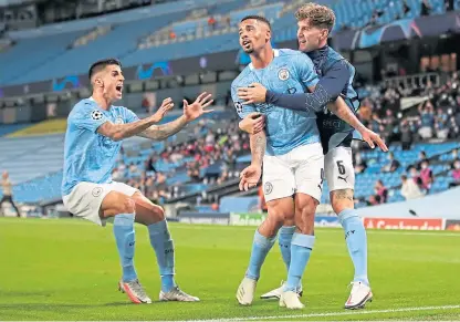  ?? Picture: PA. ?? Gabriel Jesus celebrates his goal with Joao Cancelo and substitute John Stones.
