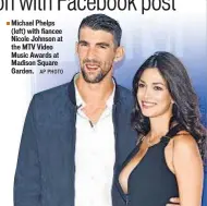  ?? AP PHOTO ?? Michael Phelps (left) with fiancee Nicole Johnson at the MTV Video Music Awards at Madison Square Garden.