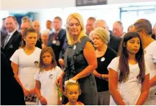  ??  ?? Mourners, including Sir John Kirwan, carried Mika’s coffin (right) as family, friends and former teammates gathered to celebrate the All Black’s life.