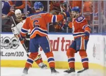  ?? JASON FRANSON, THE CANADIAN PRESS ?? Oilers Adam Larsson, left, and Leon Draisaitl celebrate a first-period goal.