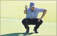  ?? Sam Greenwood / Getty Images ?? Robert Streb lines up a putt on the 17th green Friday during the second round of The RSM Classic at the Plantation Course at Sea Island Golf Club in St Simons Island, Ga. Streb holds a 2-shot lead after two rounds.