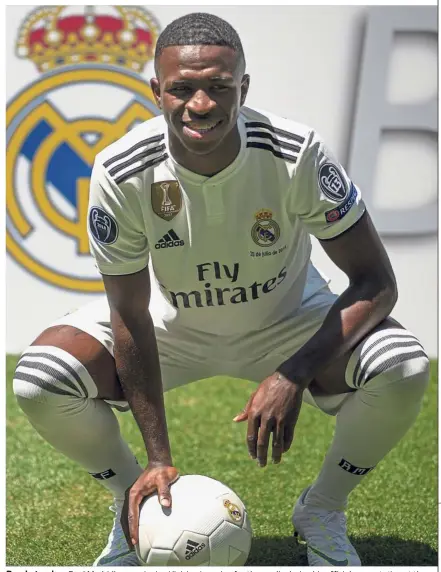  ??  ?? Ready to play: Real Madrid’s new signing Vinicius Jr posing for the media during his official presentati­on at the Bernabeu in Madrid, Spain, on Friday. — AP
