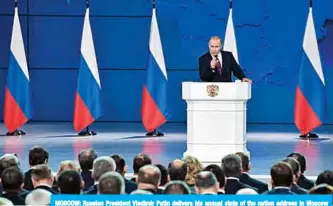  ?? —AFP ?? MOSCOW: Russian President Vladimir Putin delivers his annual state of the nation address in Moscow yesterday.