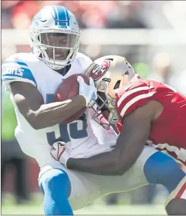  ?? NHAT V. MEYER — STAFF PHOTOGRAPH­ER ?? The Lions’ Jamal Agnew is hit hard on a punt return by the 49ers’ Raheem Mostert.