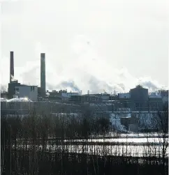  ?? DON EMMERT / AFP / GETTY IMAGES ?? The industrial town of Madawaska, Maine, is pictured across the Saint John River from the U. S.- Canada border town of Edmundston, N.B.