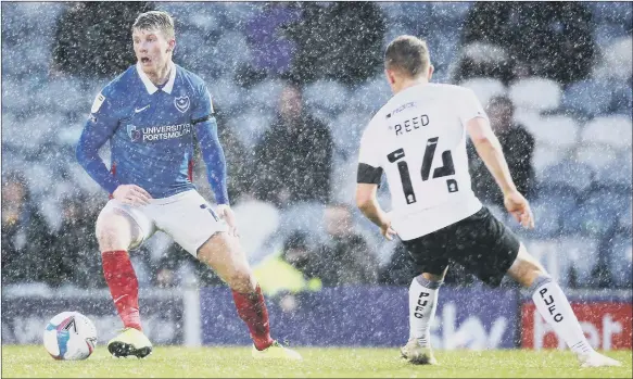  ?? Pictures: PinPeP ?? WINNING IN THE RAIN
Andy Cannon was Mark’s man of the match in Pompey’s 2-0 win at home to Peterborou­gh United on Saturday.